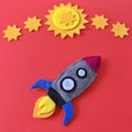 Felt Rocket Ship Flat Lay with Yellow Stars on Red