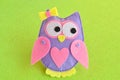 Felt soft toy owl. Felt soft toy owl on a green background Royalty Free Stock Photo