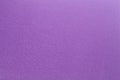 Felt surface in deep dark purple color. Abstract background