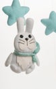 Colorful and eco-friendly children`s mobile from felt. A felt toy in the form of a lovely rabbit , part of a children`s mobile.