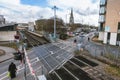 Feltham railway station with view towards the tower of the now-demolished St Catherine`s Church.