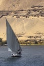Felucca river boat on the Nile, with the Sahara behind in Aswa Royalty Free Stock Photo