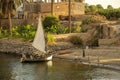 Felucca sailing boat at the shore of the Nile river, Egypt Royalty Free Stock Photo