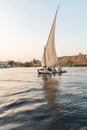 A felucca, a traditional wooden sailing boat, on the Nile river at Aswan Royalty Free Stock Photo