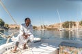 Feluccas captain Sailing his boat on the Nile near Aswan Egypt