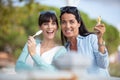 femake friends happily eating ice creams Royalty Free Stock Photo