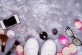 Female accessories frame composition with roses and many different perfume bottles on stone background. Flat lay, top Royalty Free Stock Photo