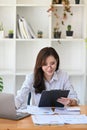 Accountant working with laptop computer and checking financial reports. Royalty Free Stock Photo