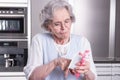 Female active pensioner is preparing strawberries Royalty Free Stock Photo
