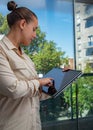 Female administrative assistant using a tablet at the office