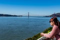 Female adult while enjoying the skyline view of San Francisco USA and Golden Gate Bridge from Viewing Deck in Alcatraz Island Royalty Free Stock Photo