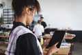 Female african american chef using digital tablet in restaurant kitchen