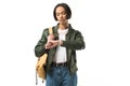 female african american student with backpack looking at wristwatch Royalty Free Stock Photo