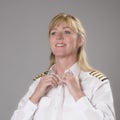 Female airline officer getting dressed