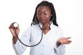 Female american african doctor, nurse woman wearing medical coat and using stethoscope. Confused, excited for success medical