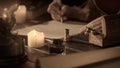 Female in antique outfit writes with feather pen. Focus on inkwell and box with spoons, woman in renaissance dress Royalty Free Stock Photo