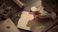 Female in antique outfit writes with feather pen. Shot of woman writing a letter with vintage quill feather pen on old Royalty Free Stock Photo