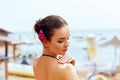 A Female  Applying Sun Cream  on  tanned  shoulder.Sun protection.Sun Protection, girl using sunscreen to safe her skin Royalty Free Stock Photo