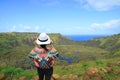 Female Appreciating the Breathtaking View of Rano Kau Crater Lake from Orongo Ceremonial Village on Easter Island, Chile