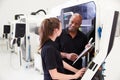 Female Apprentice Working With Engineer On CNC Machinery Royalty Free Stock Photo