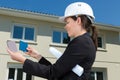 Female architect checking colours at large construction site Royalty Free Stock Photo