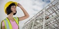 Composite image of female architect in hard hat looking away against white background Royalty Free Stock Photo
