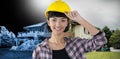 Composite image of female architect in hard hat standing against white background Royalty Free Stock Photo