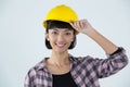 Female architect in hard hat standing against white background Royalty Free Stock Photo