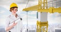 Female architect holding plan by crane