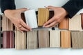 female architect or interior designer hand holding wooden color samples Royalty Free Stock Photo