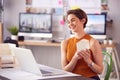 Female Architect In Office Making Video Call At Desk On Laptop And Showing Model Of House Design Royalty Free Stock Photo