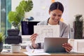 Female Architect In Office Sitting At Desk Showing Plans For New Building On Video Call Royalty Free Stock Photo