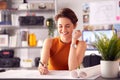 Female Architect In Office Working At Desk Making Notes On Plan Or Blueprint Royalty Free Stock Photo