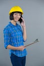 Female architect talking on mobile phone Royalty Free Stock Photo