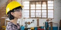 Composite image of female architect wearing hard hat and safety glasses against white background Royalty Free Stock Photo