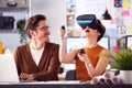 Female Architect Wearing VR Headset In Office Working With Male Colleague At Desk With Laptop Royalty Free Stock Photo