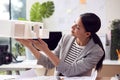 Female Architect Working In Office Studying Model Of New Building Royalty Free Stock Photo