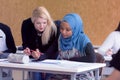 Female Architecture teacher at work. Female professor explain architectural projects to students. Beautiful female university