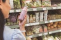 Female arm holding bottle of yoghourt