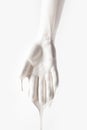 Female arm in white dripping paint isolated on white Royalty Free Stock Photo