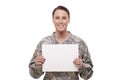 Female army soldier with a placard