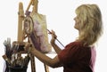 Female artist in her fifties painting Royalty Free Stock Photo