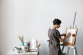 Female artist in her spacious white studio Royalty Free Stock Photo