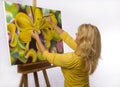 A female artist painting in her studio Royalty Free Stock Photo