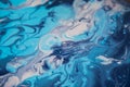 Female artist works on abstract fluid art painting with marble effect