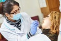 Female asian dentist doctor at work