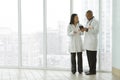 Female Asian doctor with African American doctor with tablet Royalty Free Stock Photo