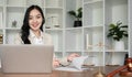 A female Asian lawyer reviews business and real estate laws. Legal consultants provide legal advice and guidance Royalty Free Stock Photo