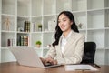 A female Asian lawyer reviews business and real estate laws. Legal consultants provide legal advice and guidance Royalty Free Stock Photo