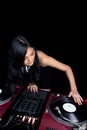 Female Asian mixing on turntables Royalty Free Stock Photo